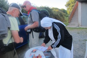 Rick and I getting a stamp from a group of nuns.