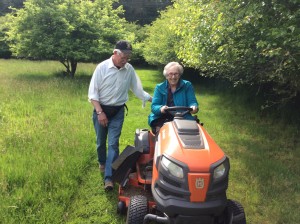 Sister Joyce driving Phil's Camino on the riding mower.   We know how to have fun.