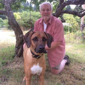 Bill's graduation pic.  That's Maizie, one of his Rhodesian Ridgebacks.   